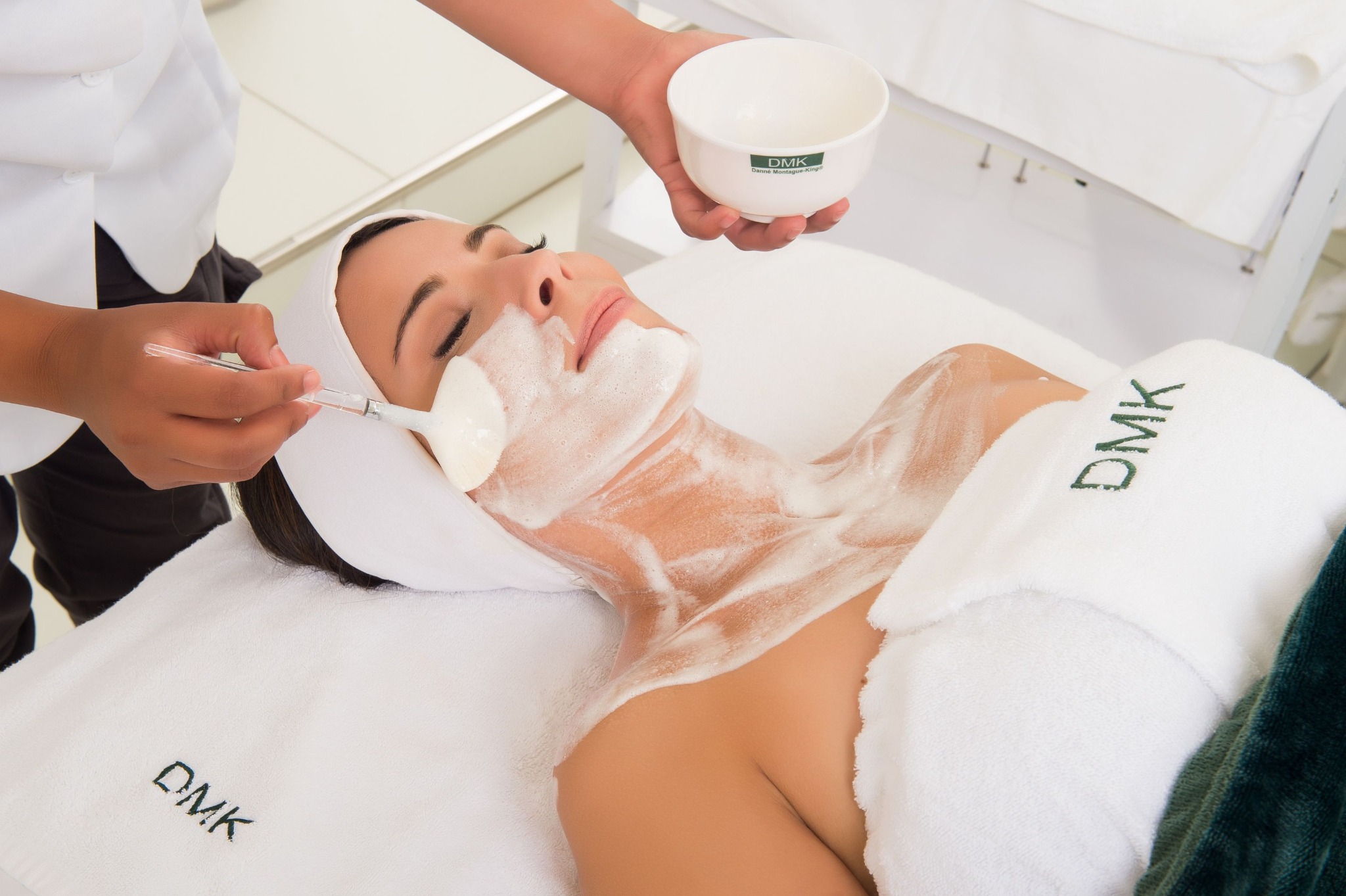 DMK enzyme treatment being applied to a client at Advanced Body Image