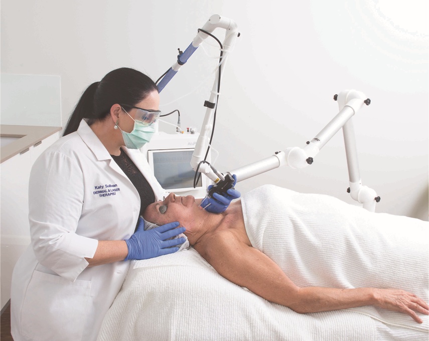 Katy Sullivan performing a laser treatment at Advanced Body Image