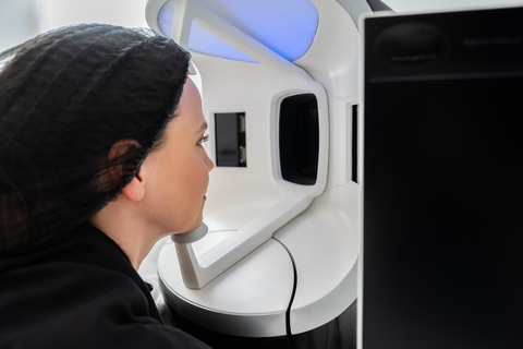 Client positioned for VISIA facial skin analysis